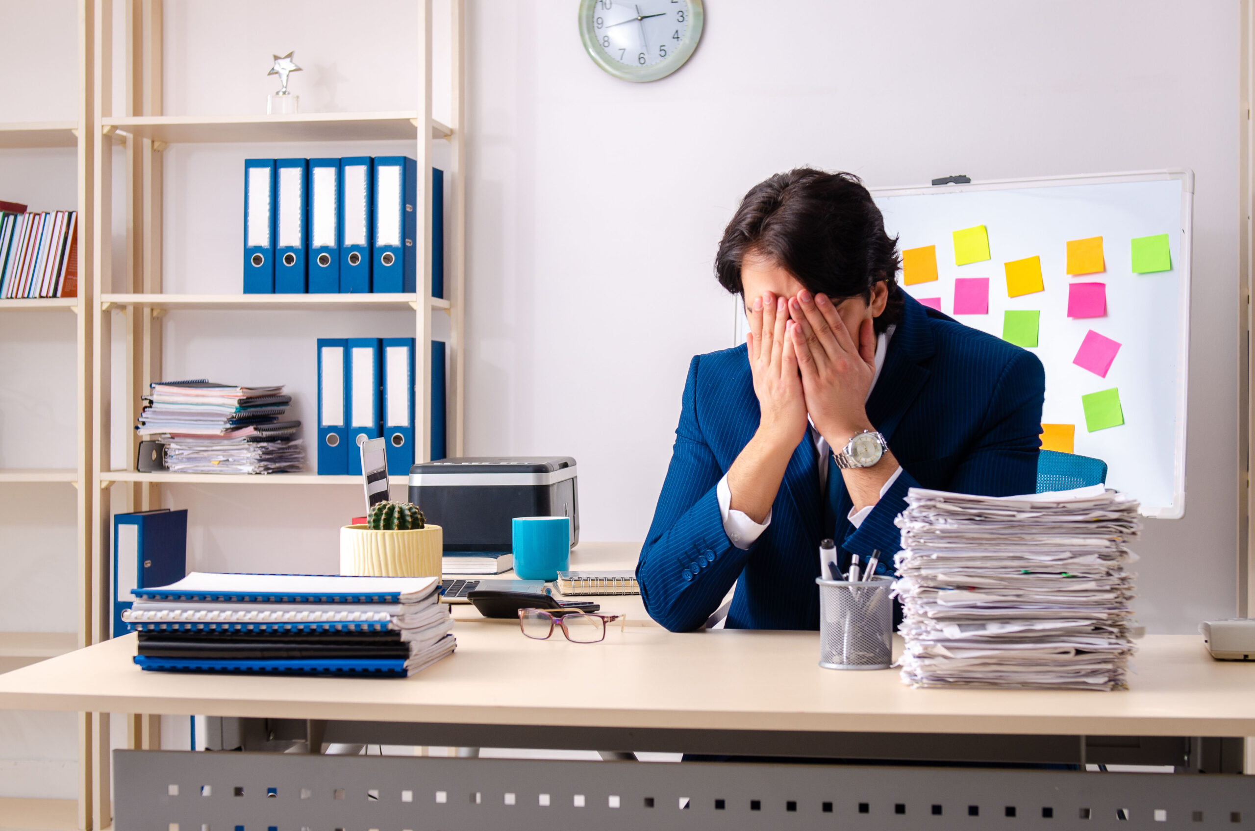 Burned out employee overwhelmed by his work